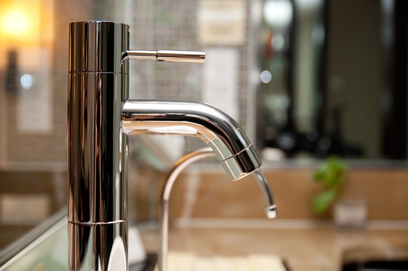 Leaking tap being repaired in Bethnal Green